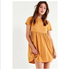 Mustard color babydoll dress from Urban Outfitters